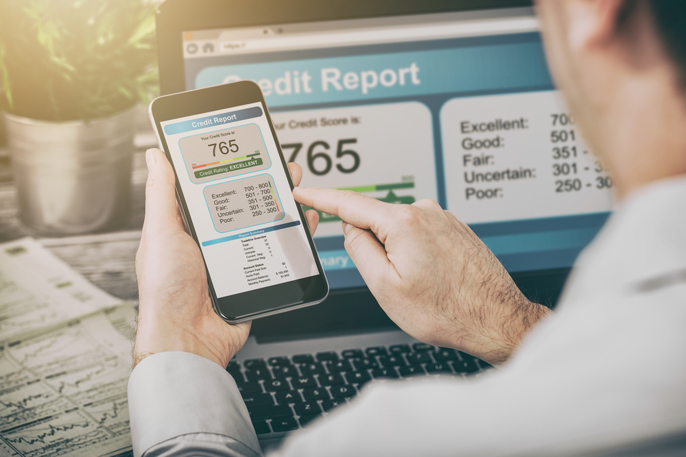 Man checking credit score to take out car loan in toronto