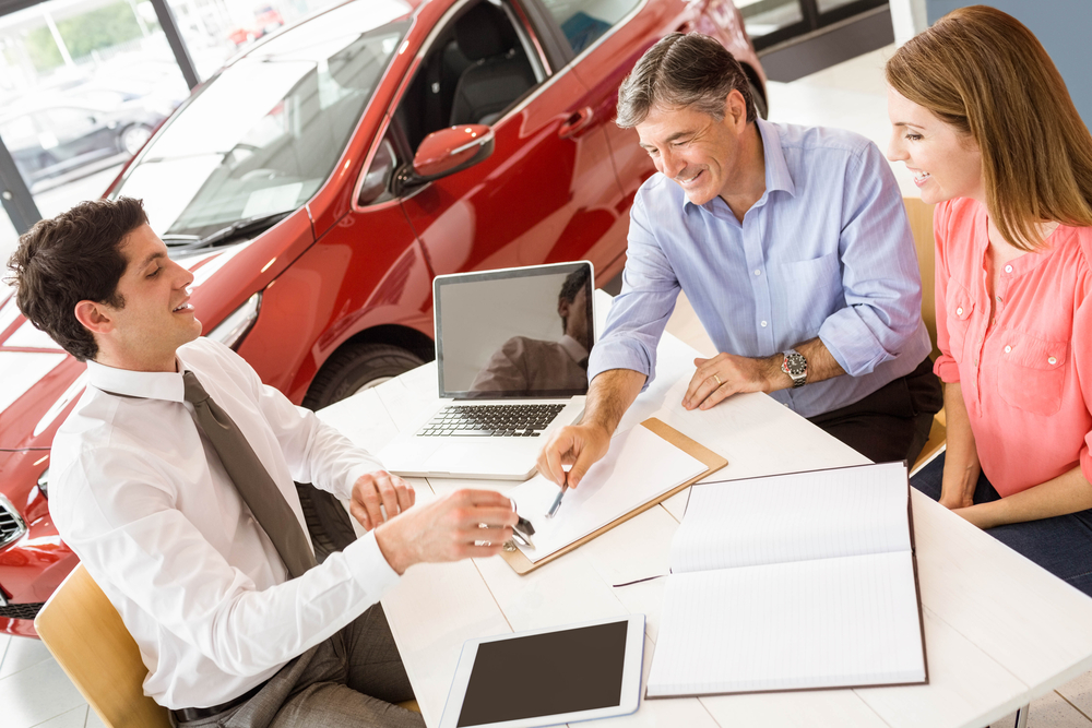 Couple building credit history by taking out a car loan in Toronto.