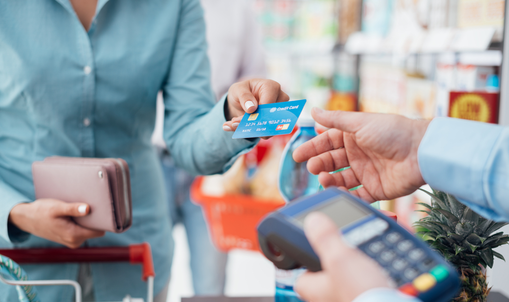  Woman building credit history by shopping with credit card. 