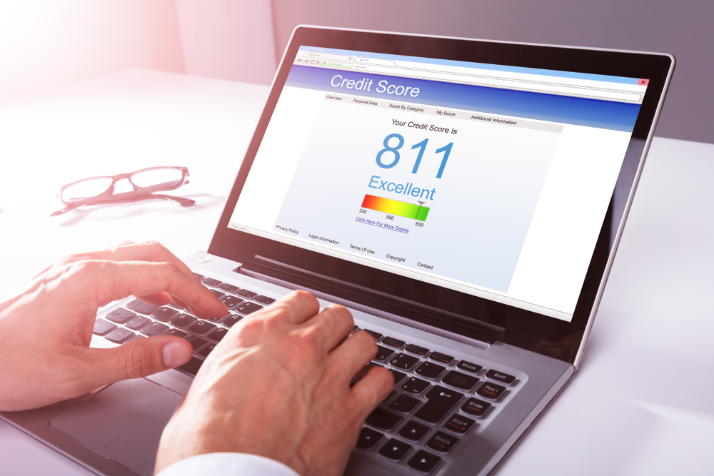 Gentleman looking up his credit score online before applying for a car loan in Toronto. 