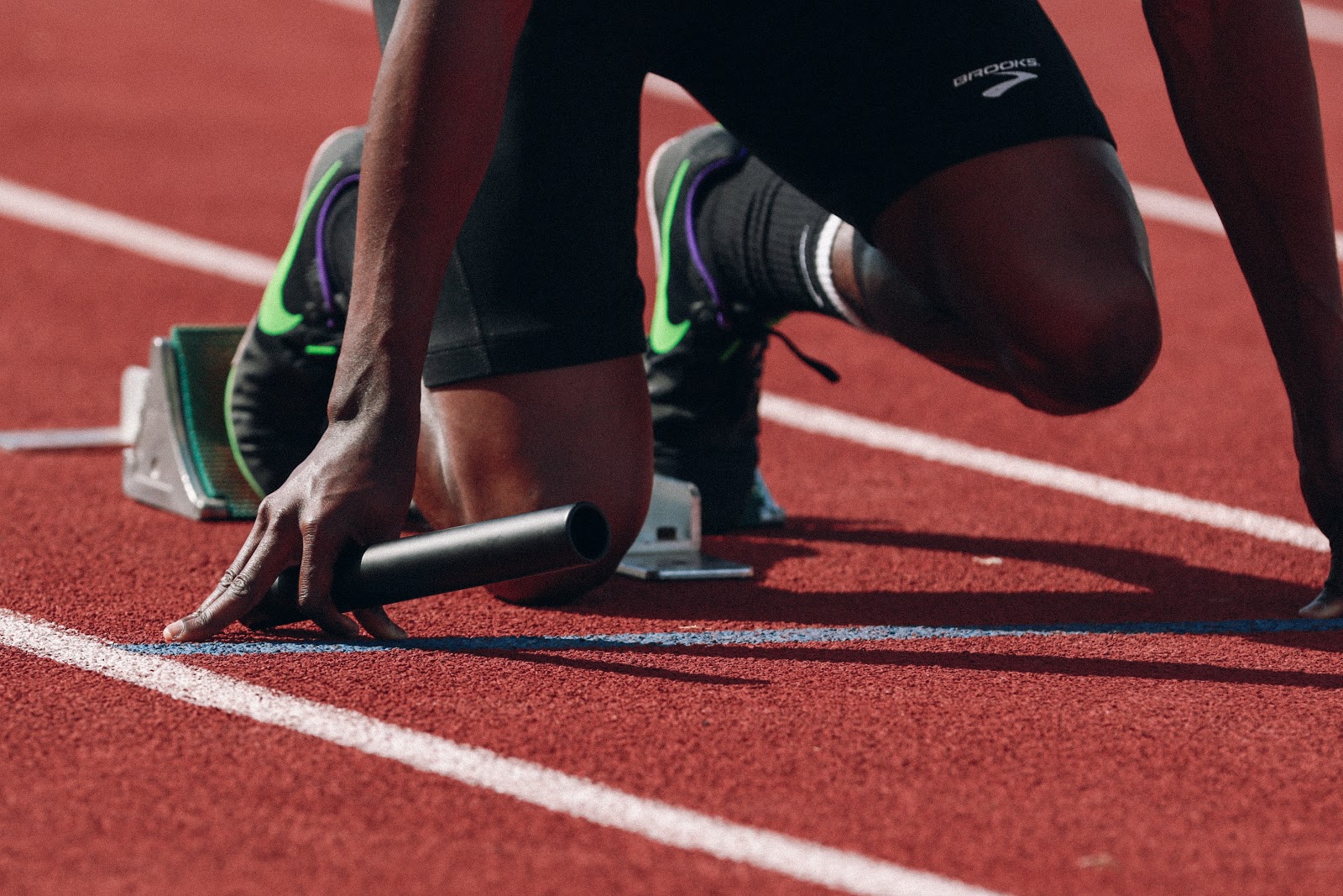 A sprinter getting ready to leave the blocks.