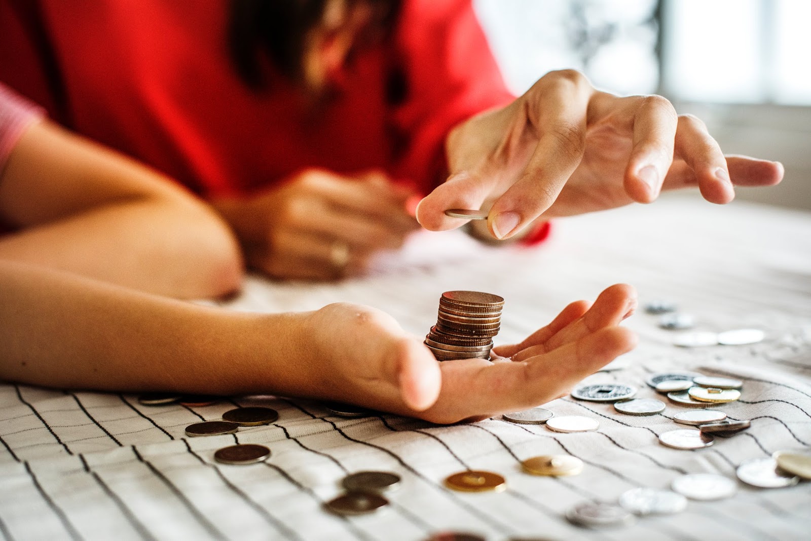 Somebody counting pennies into their hand.